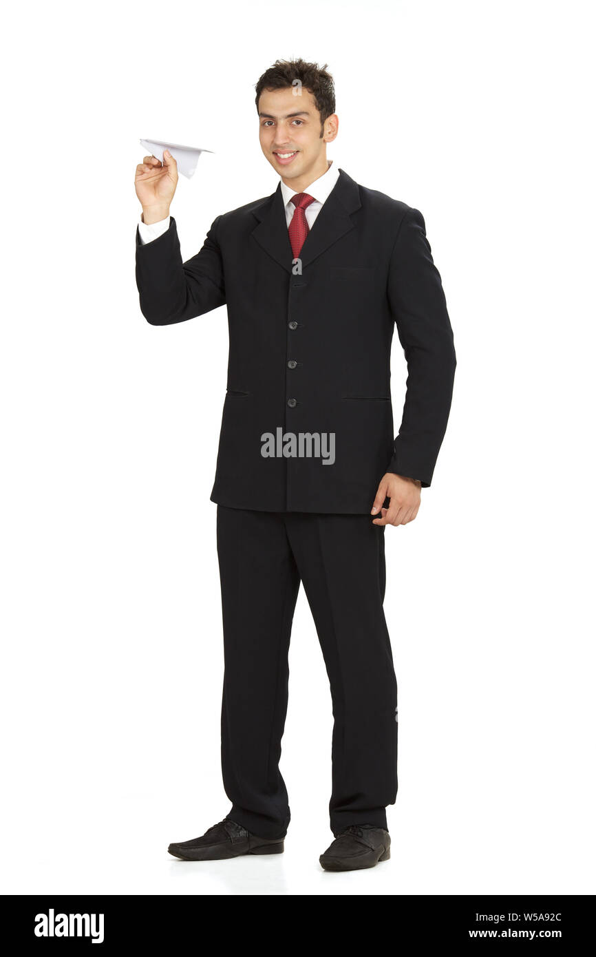 Businessman playing with paper airplane Stock Photo