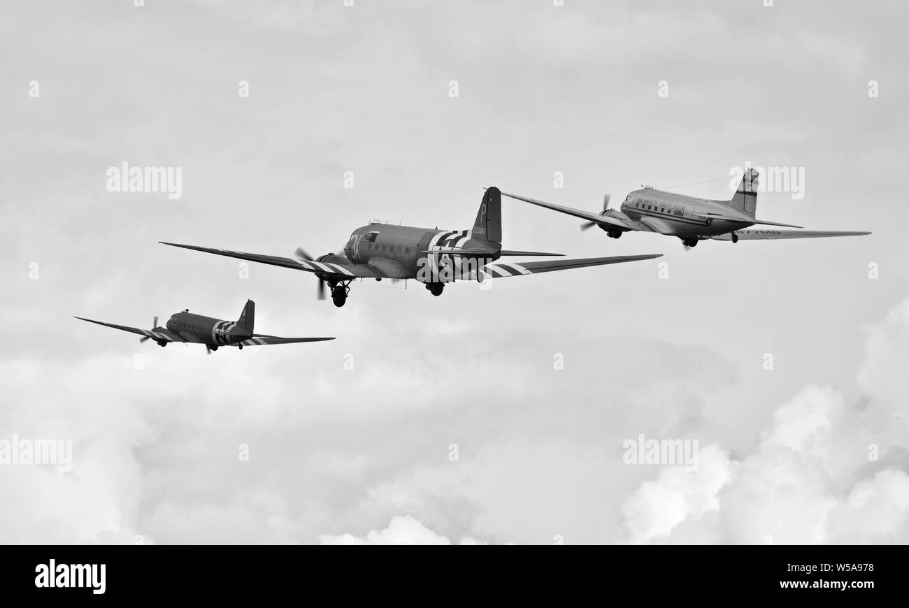 D-Day Tribute - Three C-47s flying in formation at the 2019 Flying Legends Airshow Stock Photo