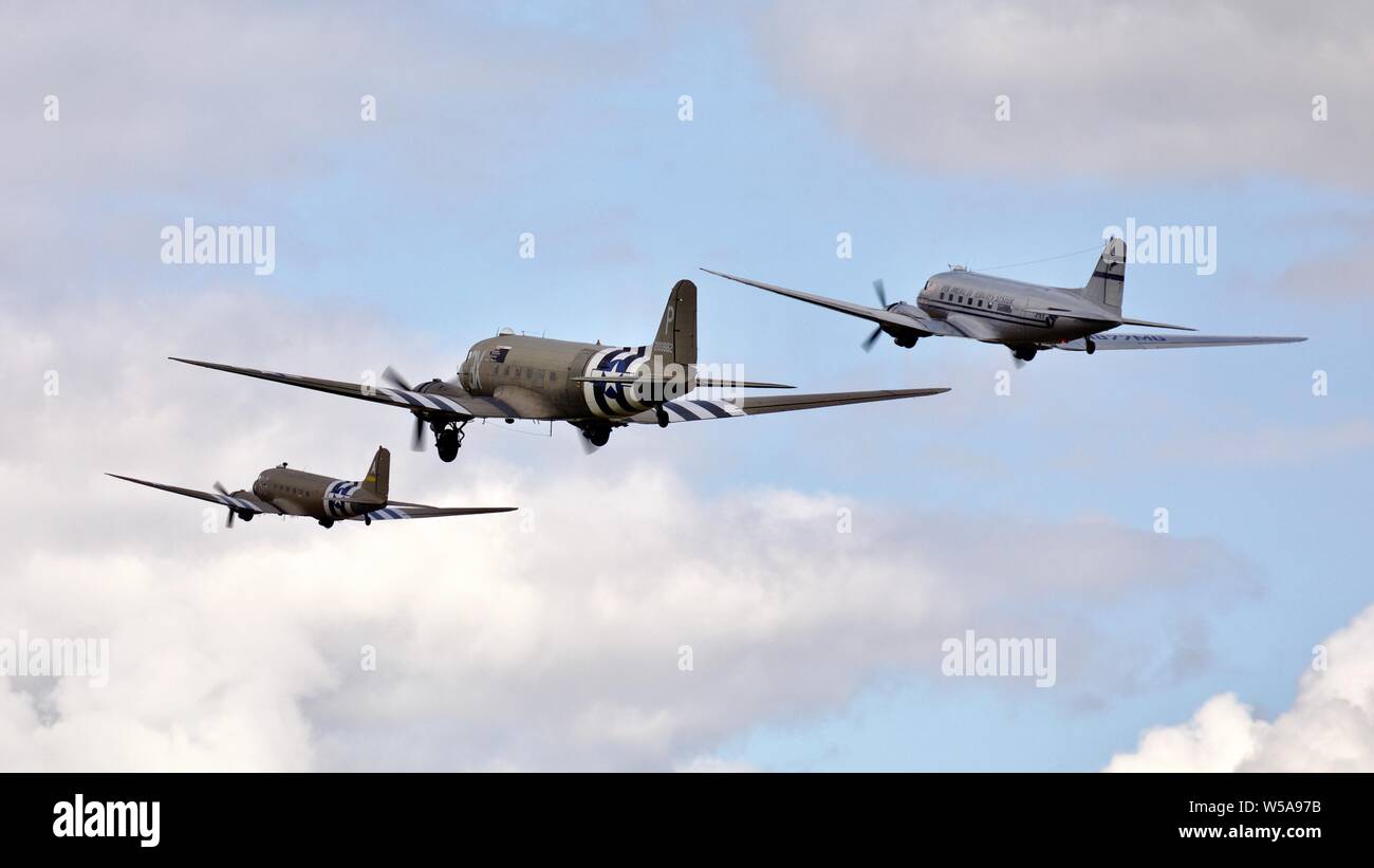 D-Day Tribute - Three C-47s flying in formation at the 2019 Flying Legends Airshow Stock Photo