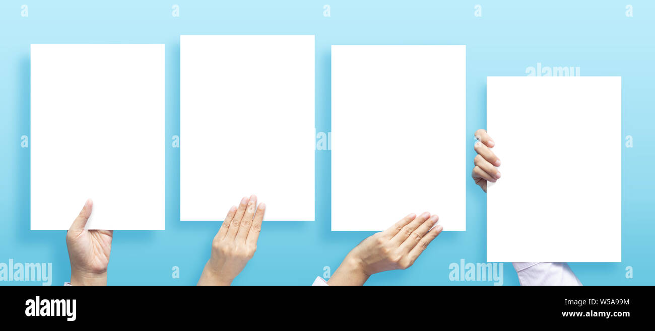 set of hands holding empty white blank letter paper size A4 for flyer or invitation mock up in different composition isolated on a blue background. Stock Photo