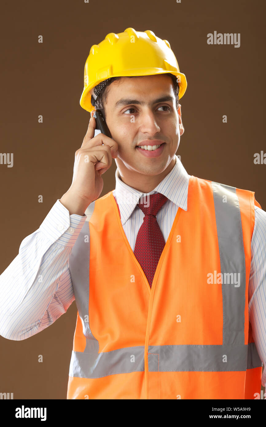 Male architect talking on mobile phone Stock Photo