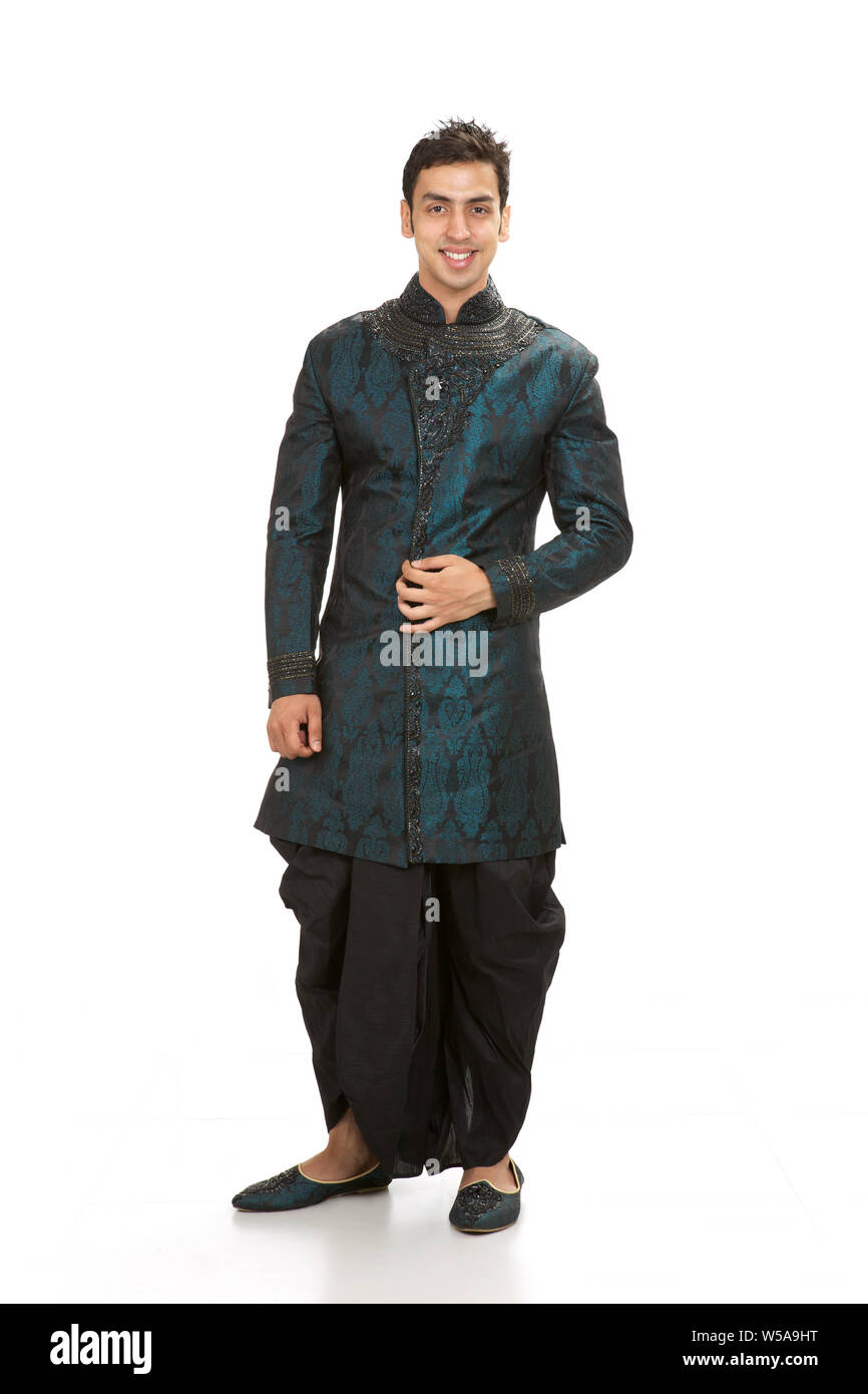Indian groom standing and smiling Stock Photo