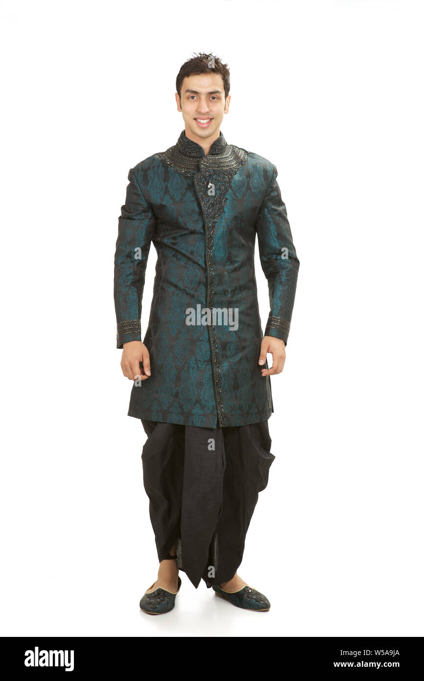 Indian groom standing and smiling Stock Photo