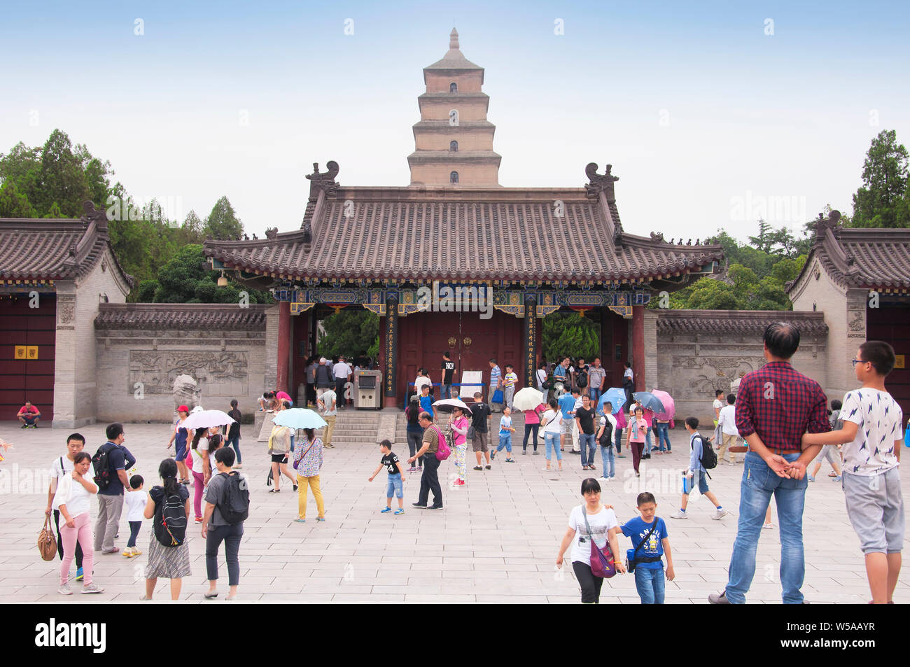 August 19, 2015. Xian, China.  Crowds of people outside the giant wild goose pagoda or Dayan Pagoda locaed at Da Cien Temple complex in Xian China on Stock Photo