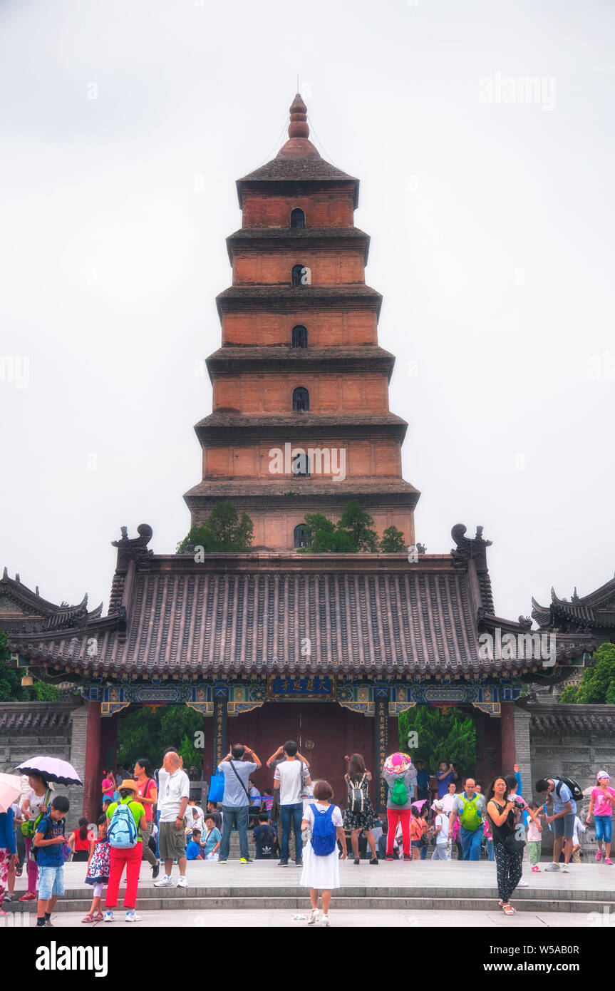 August 19, 2015. Xian, China.  Crowds of people outside the giant wild goose pagoda or Dayan Pagoda located at Da Cien Temple complex in Xian China on Stock Photo