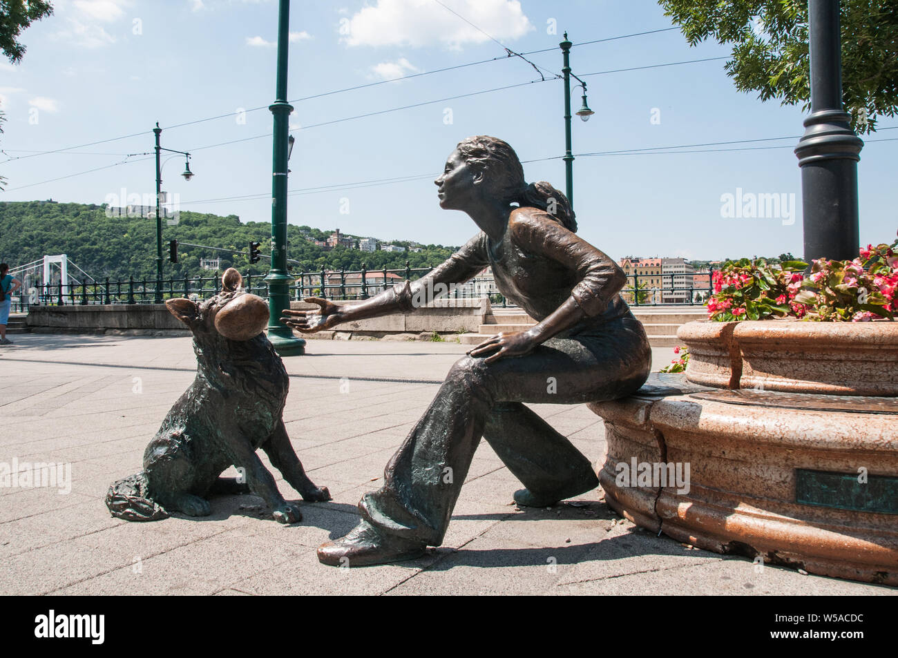 Around Budapest A girl with her dog sculpture on the banks of the