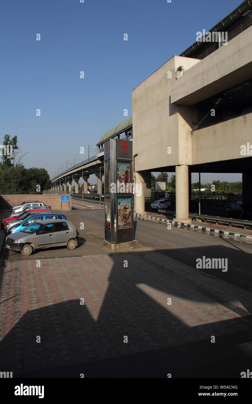 Cars parked at a metro station, New Delhi, India Stock Photo