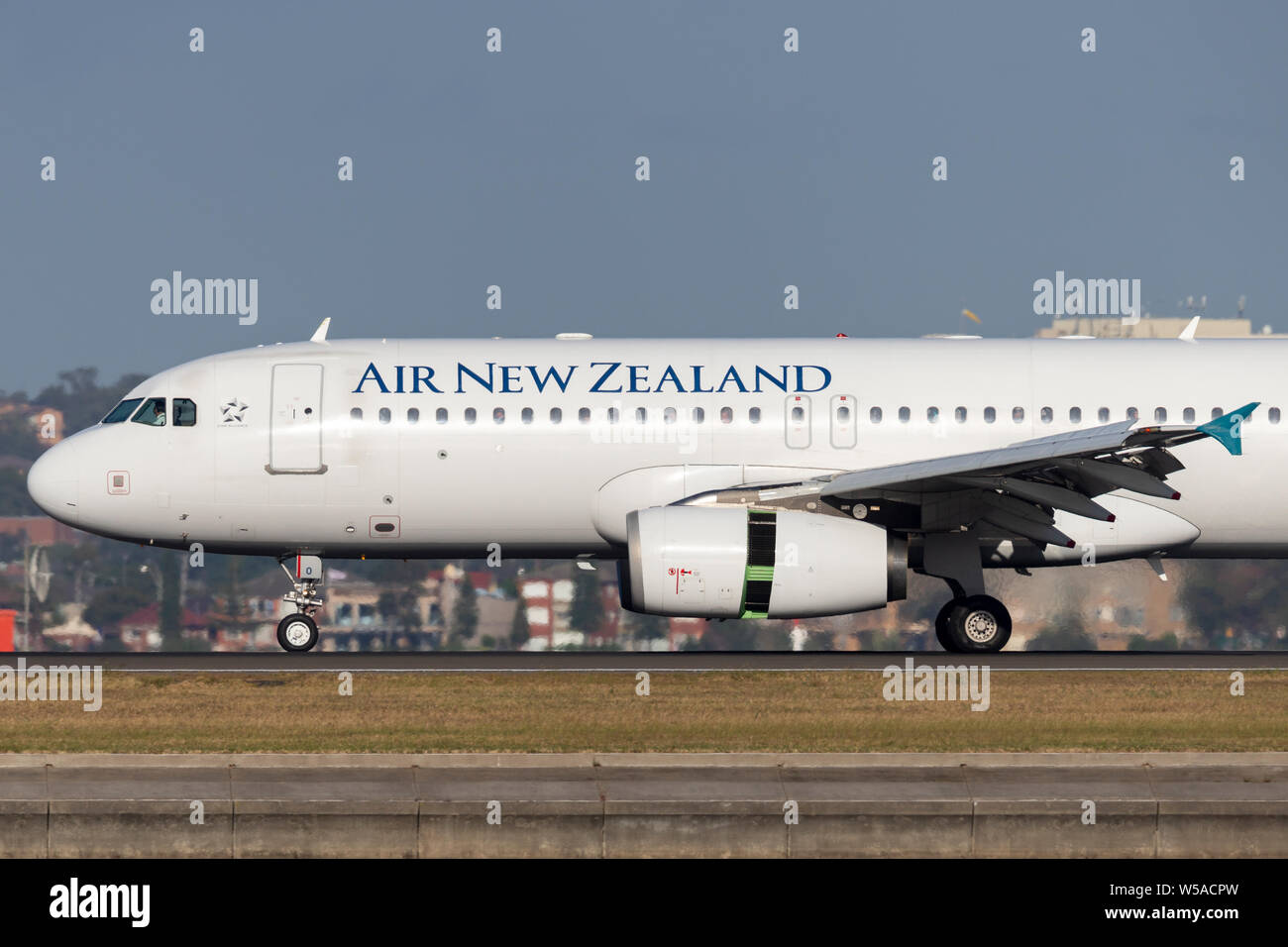 Air New Zealand Airbus A320 twin engined commercial airliner taking off from Sydney Airport. Stock Photo