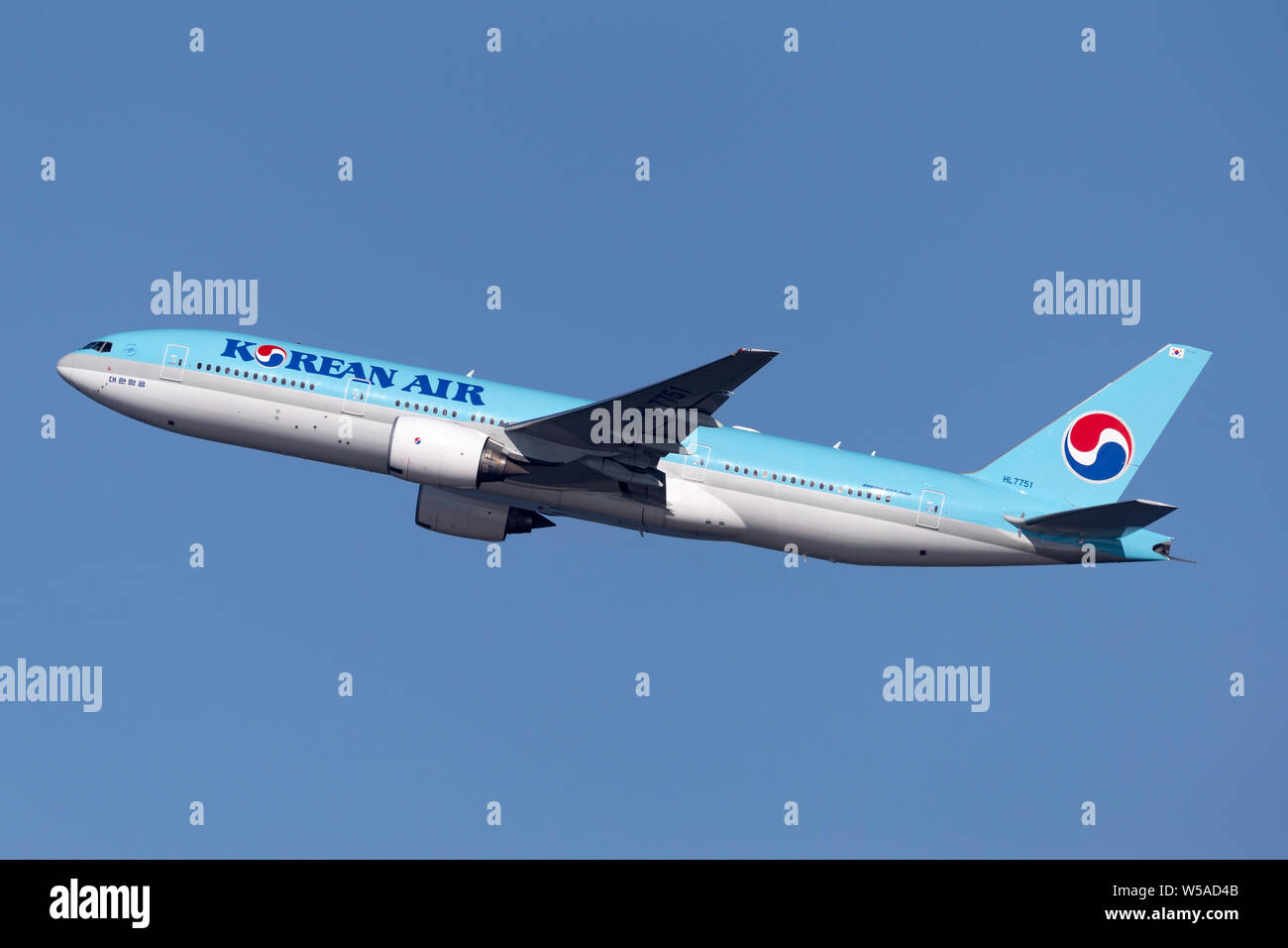 Korean Air Boeing 777 large commercial aircraft climbing out on ...