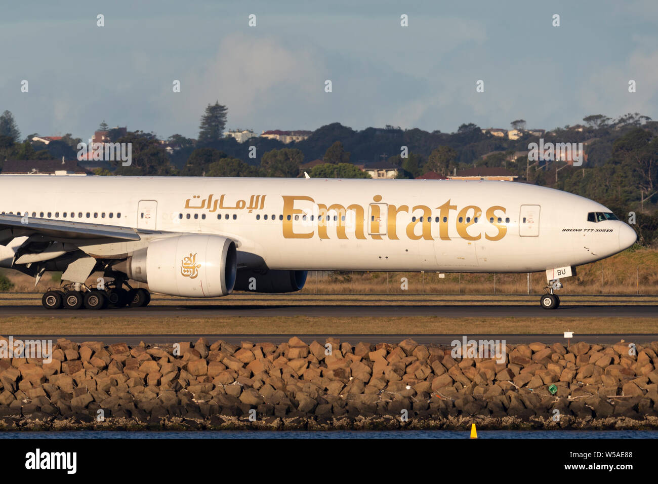 Emirates Boeing 777 aircraft on the tarmac after landing at Sydney Airport. Stock Photo