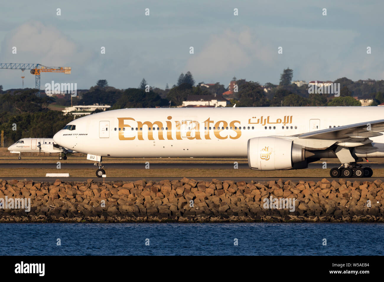 Emirates Boeing 777 aircraft on the tarmac after landing at Sydney Airport. Stock Photo