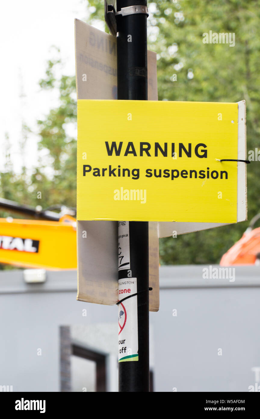Parking Suspension warning on a lamp post in London Stock Photo Alamy