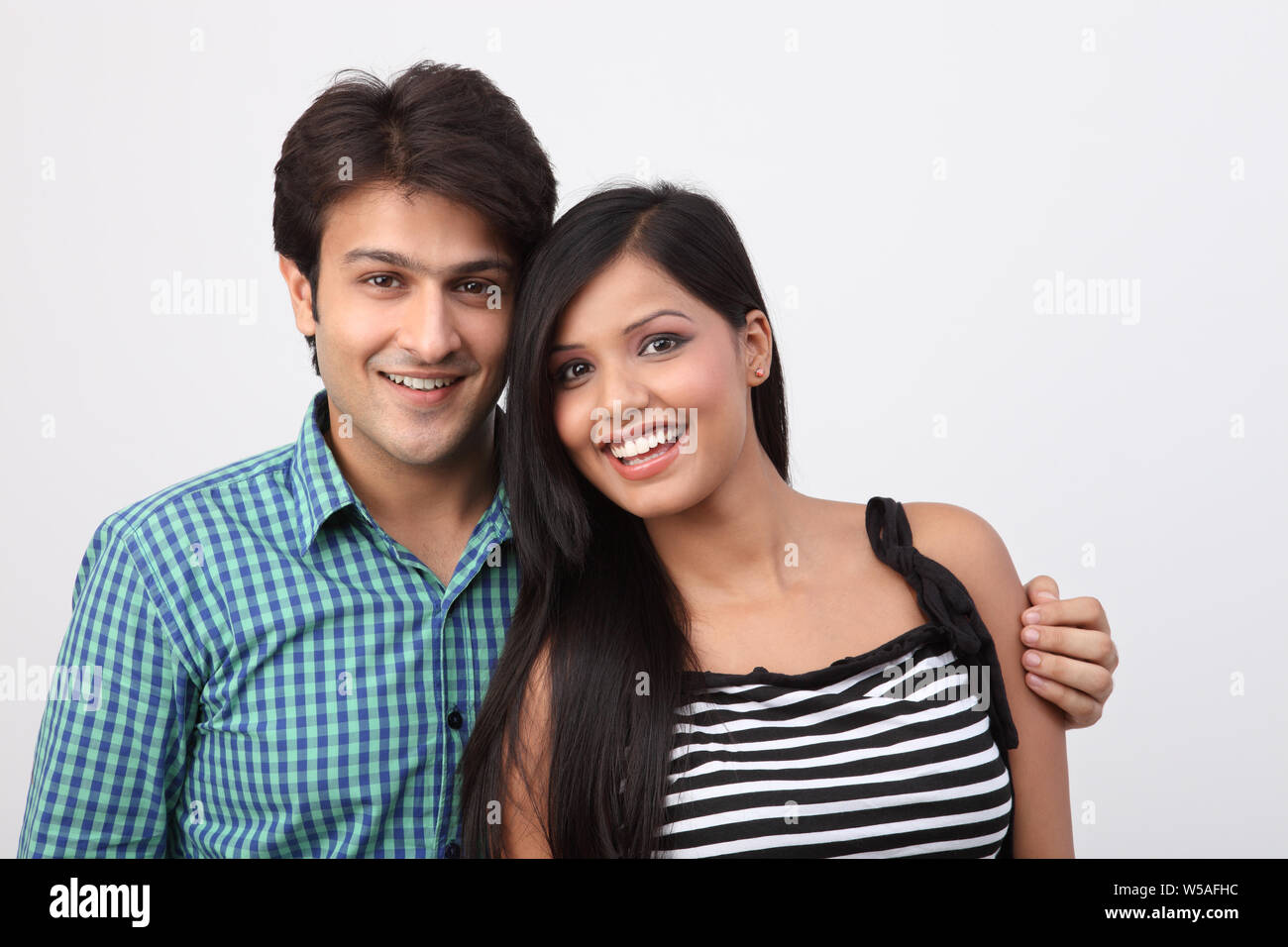 Portrait of an Indian young couple smiling Stock Photo - Alamy