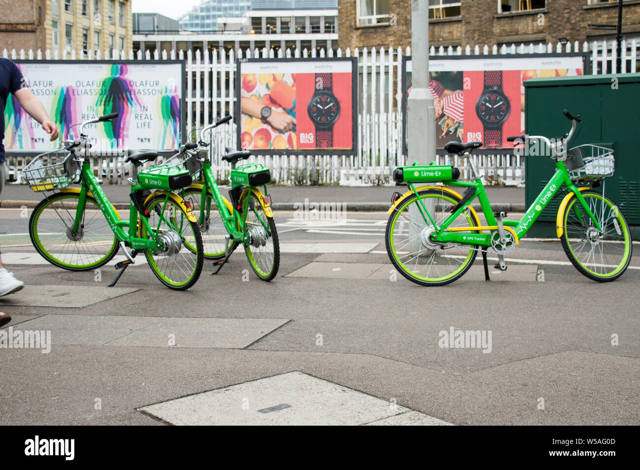 Electric bikes LimeE parked on pavement in London Stock Photo Alamy