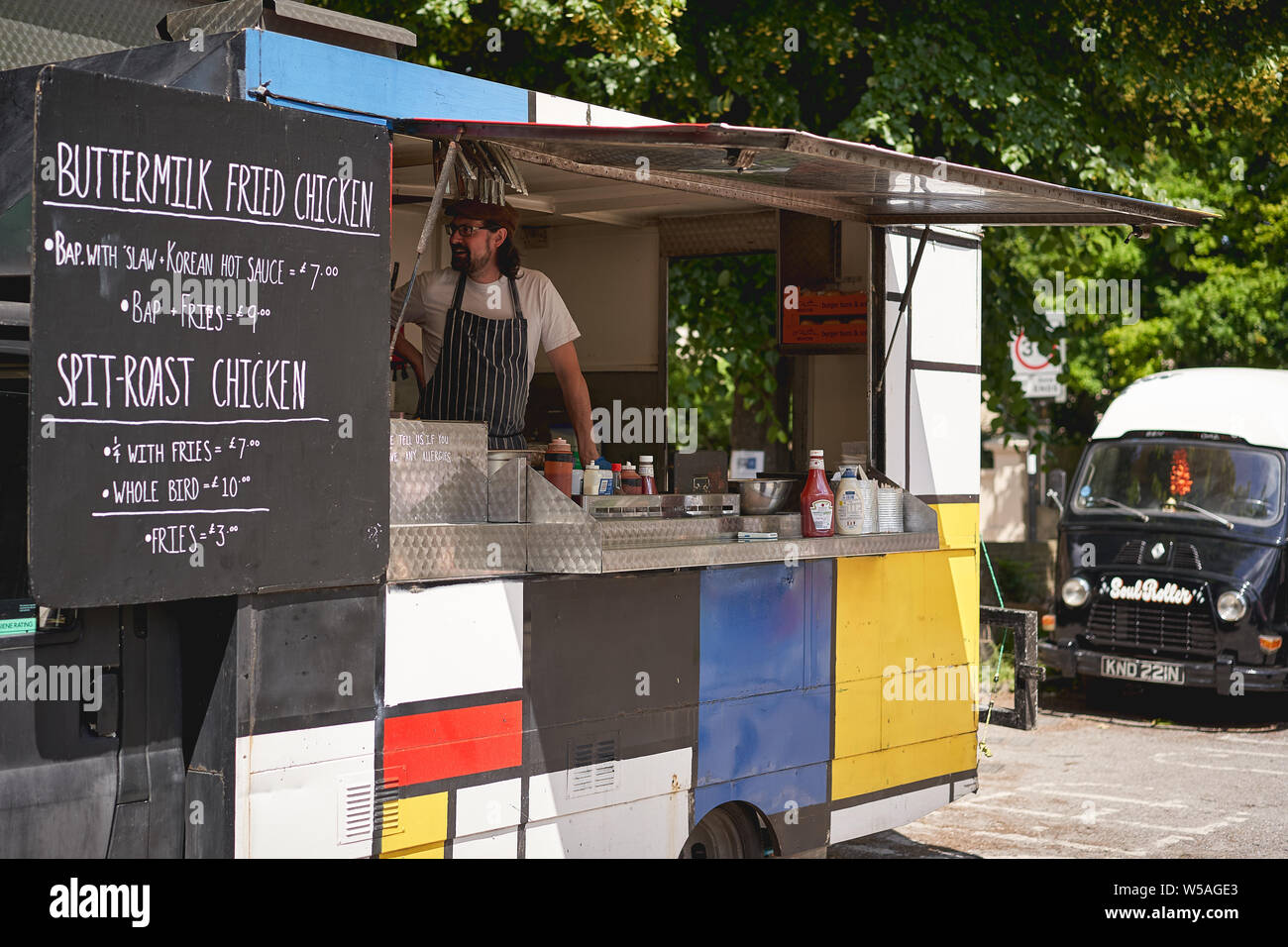 London, UK - July, 2019. Fried chicken stall at Brockley Market, local farmer market held every Saturday in Lewisham. Stock Photo