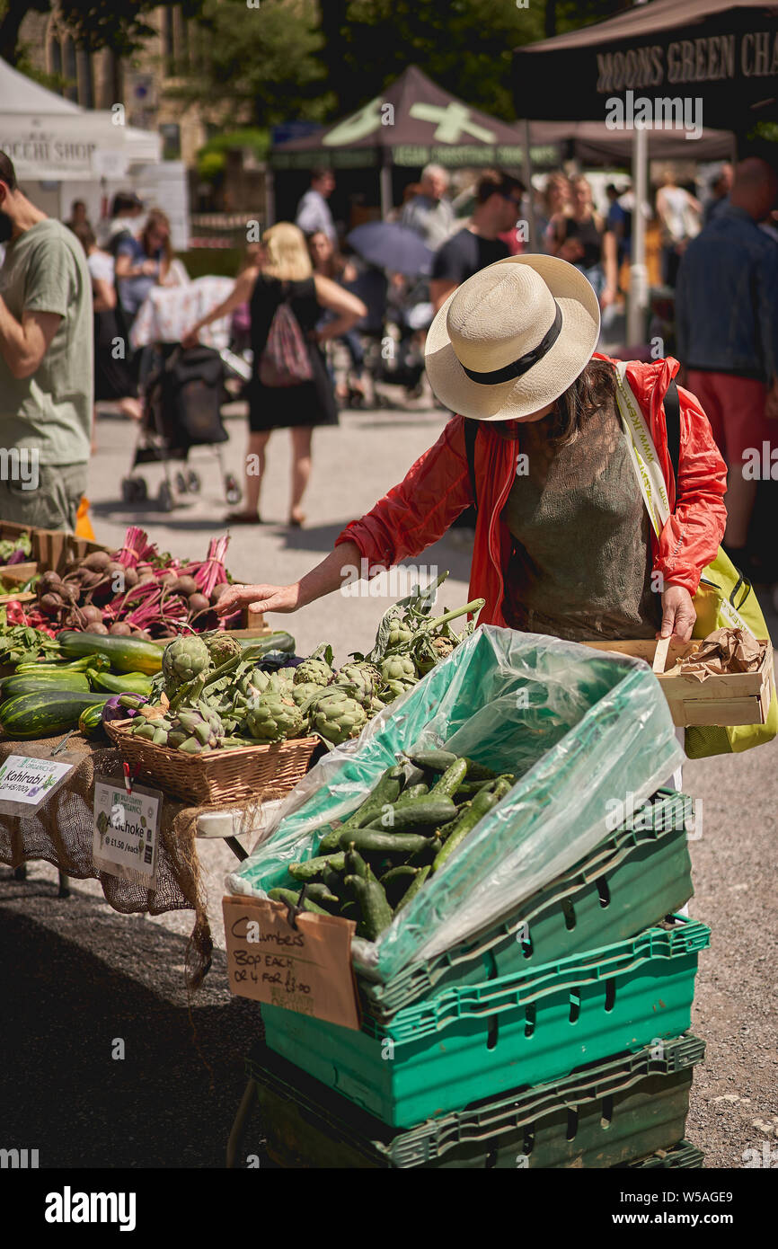 London, UK - July, 2019. Young people shopping organic vegetables in a local farmer's market in Brockley, South-East London. Stock Photo