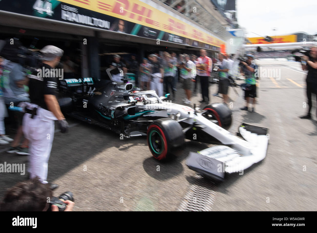 Hockenheim, Germany. 27th July, 2019. Motorsport: Formula 1 World Championship, Grand Prix of Germany. Lewis Hamilton from Great Britain of the Mercedes-AMG Petronas team drives in the pit lane during the third free practice session. Credit: Sebastian Gollnow/dpa/Alamy Live News Stock Photo