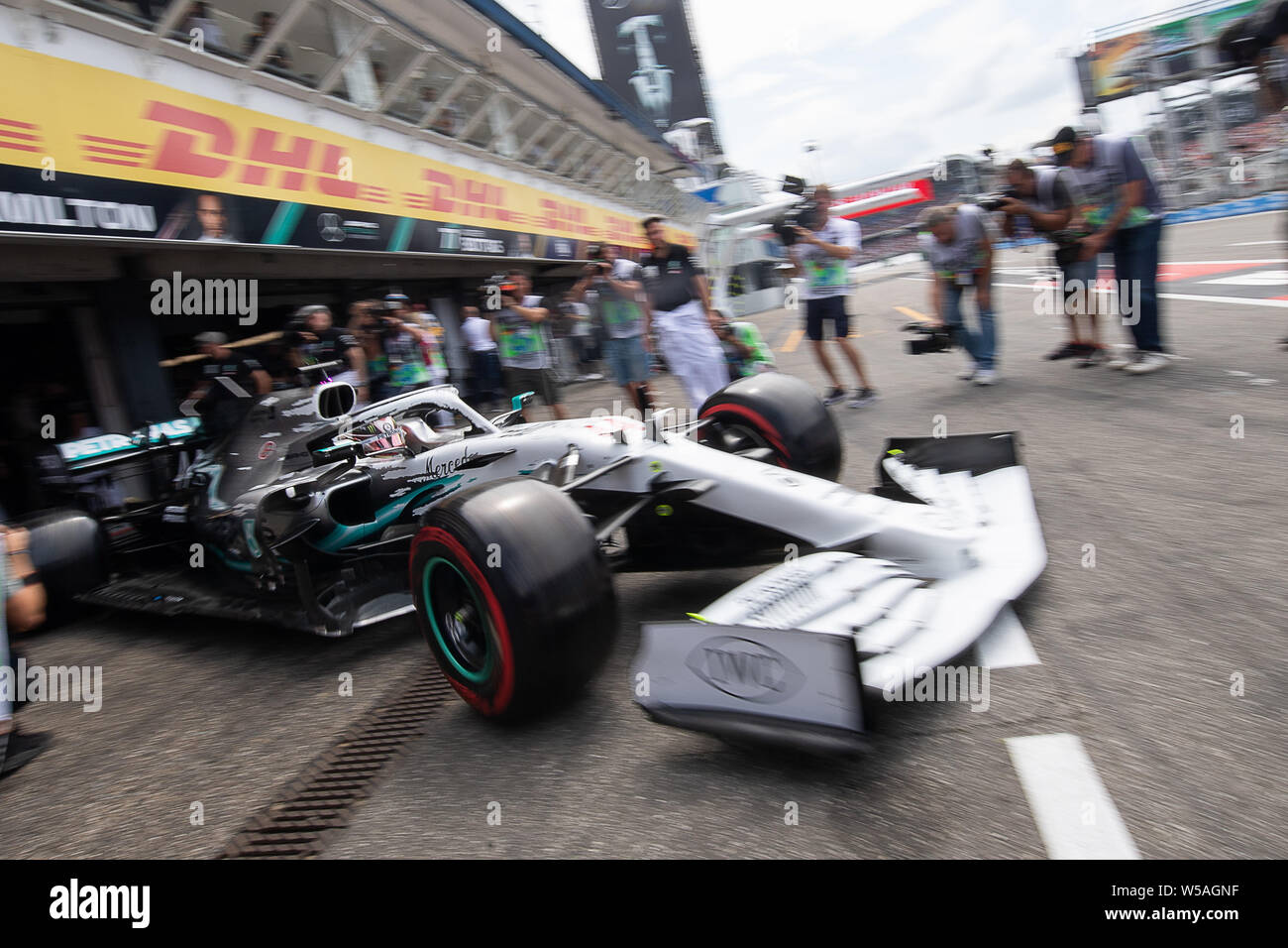 Hockenheim, Germany. 27th July, 2019. Motorsport: Formula 1 World Championship, Grand Prix of Germany. Lewis Hamilton from Great Britain of the Mercedes-AMG Petronas team drives in the pit lane during the third free practice session. Credit: Sebastian Gollnow/dpa/Alamy Live News Stock Photo