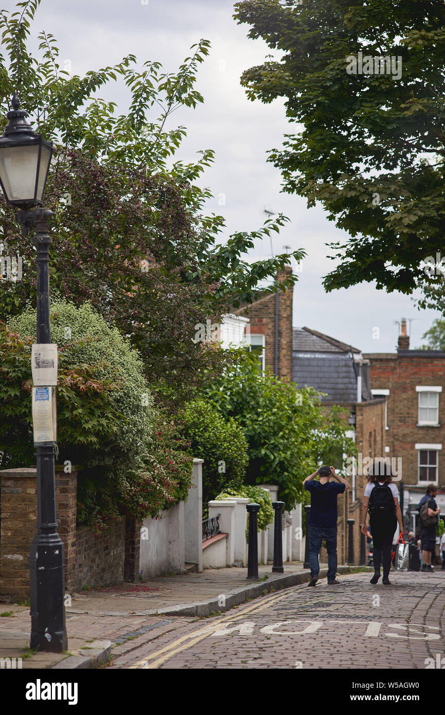 London, UK - July, 2019. Residential street with typical Georgian houses in Hampstead, an elegant residential area in North London. Stock Photo