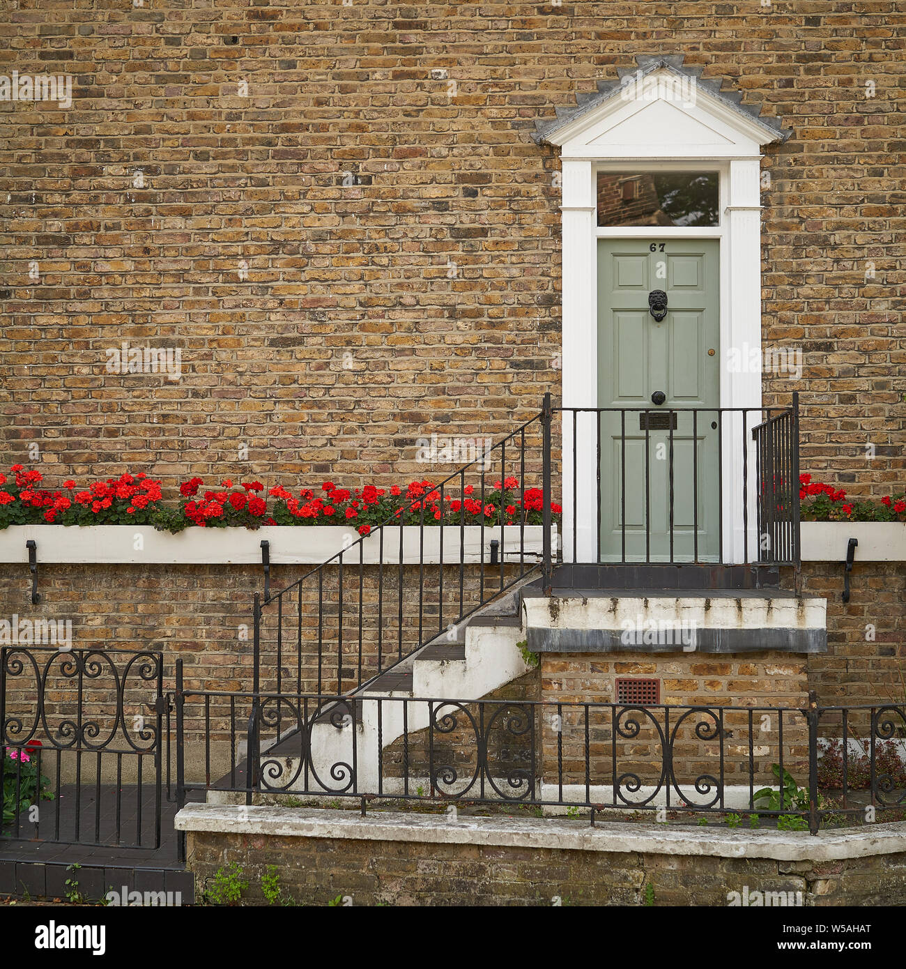 London, UK - July, 2019. Typical coloured entrance door of a Georgian Terrace in a residential area in London. Stock Photo