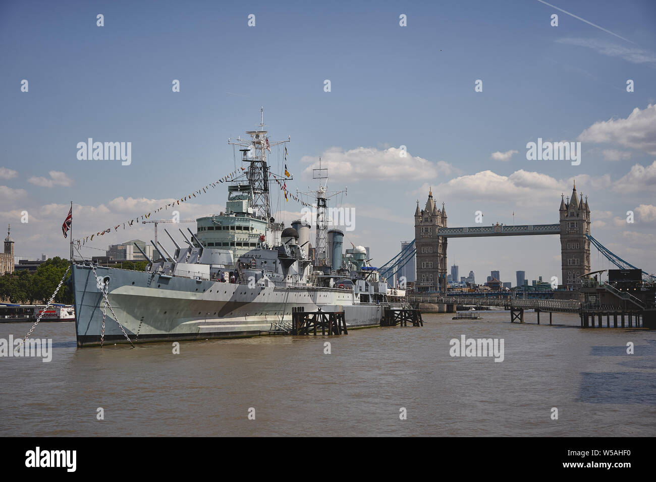 London, UK - July, 2019. View of the HMS Belfast with the Tower Bridge on the background. Stock Photo