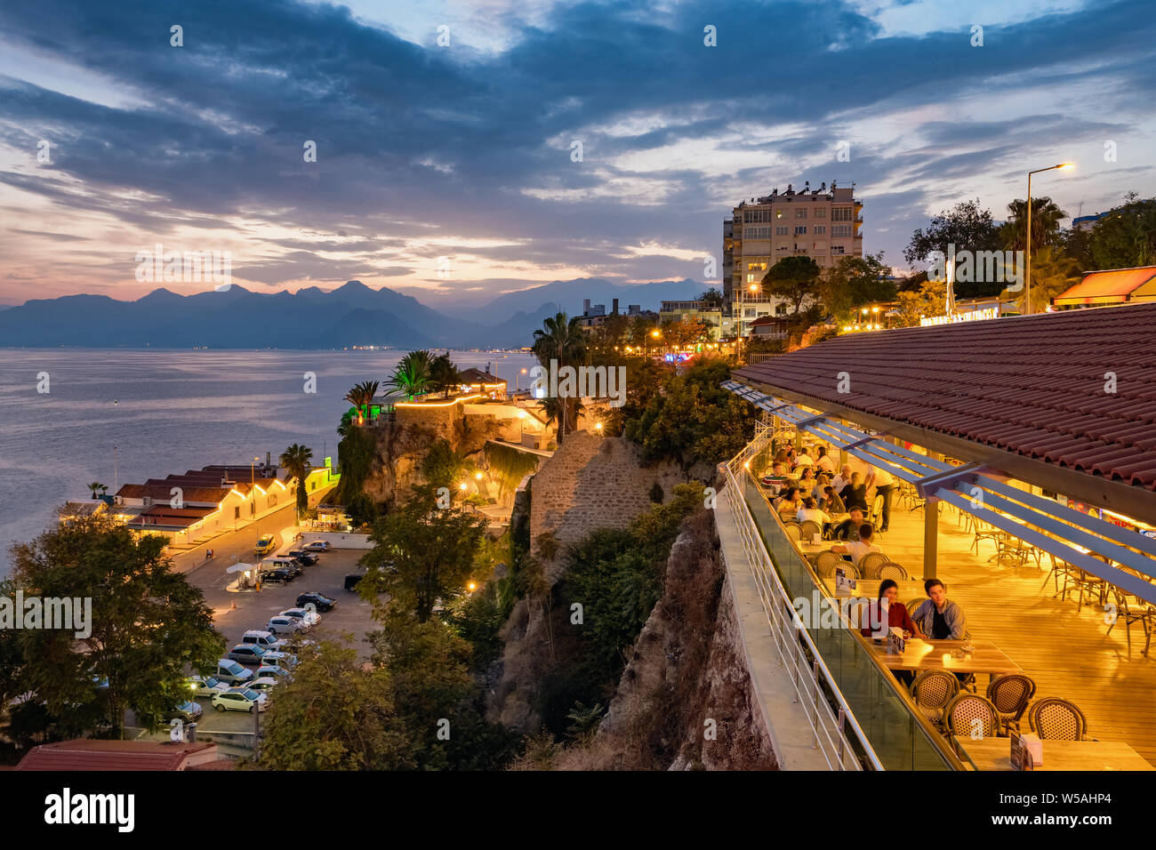 Antalya, Turkey - October 23, 2018: Outdoor cafe in Antalya old town called Kaleici at sunset, Turkey Stock Photo