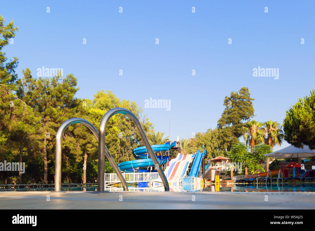 Water Rides Ladder Grab rail ladders, in the background are water rides Stock Photo - Alamy