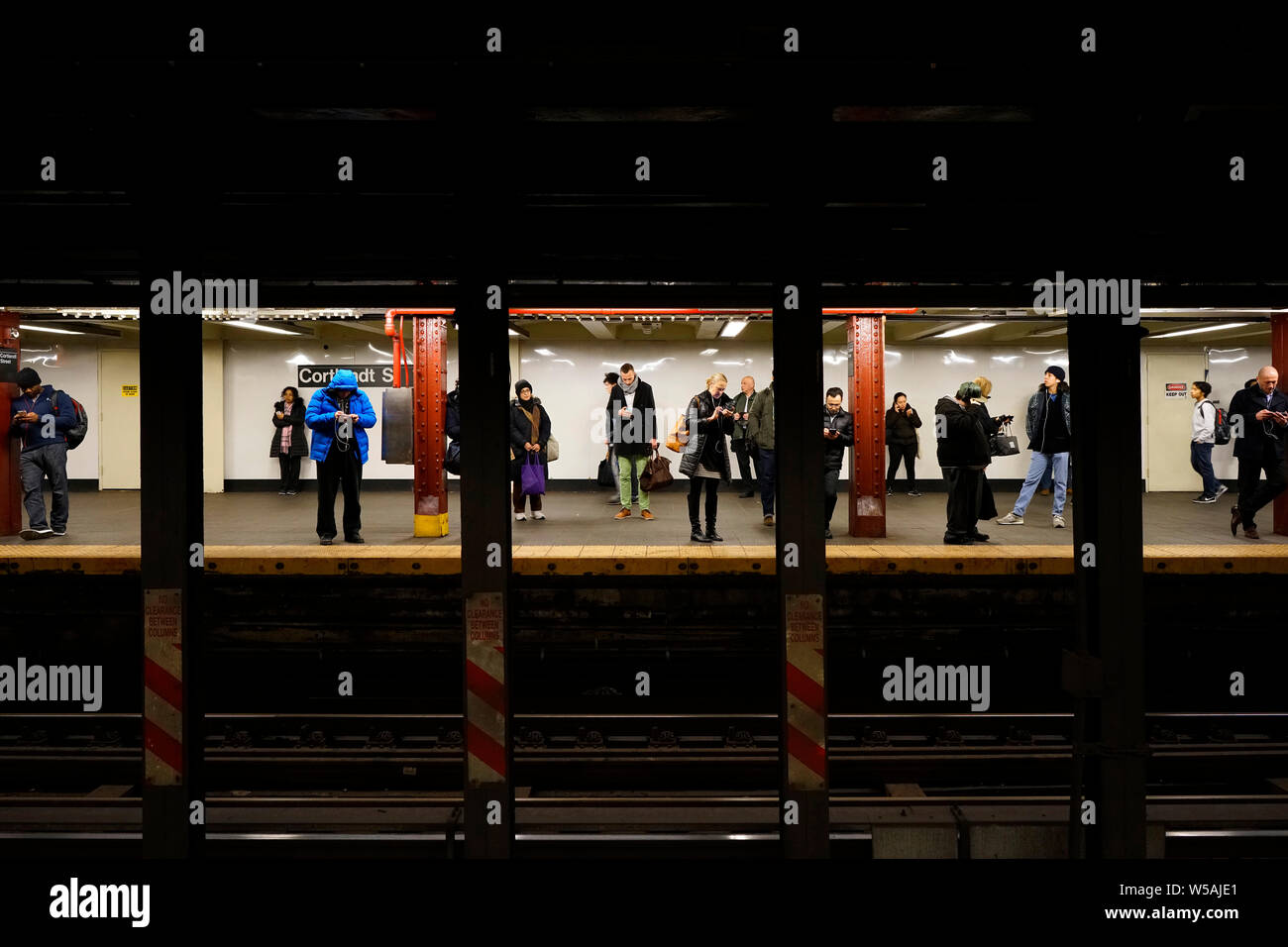 Passengers of the New York City Subway waiting for the train at the station 'Cortlandt Street'. Manhatten, New York City, New York, United States Stock Photo