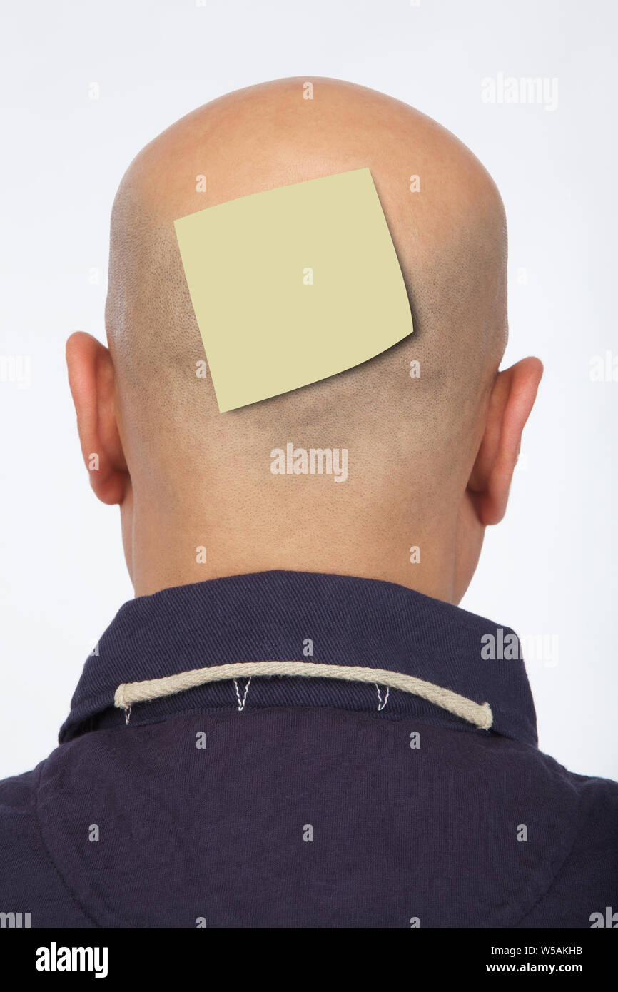 Man with adhesive note on back of head Stock Photo