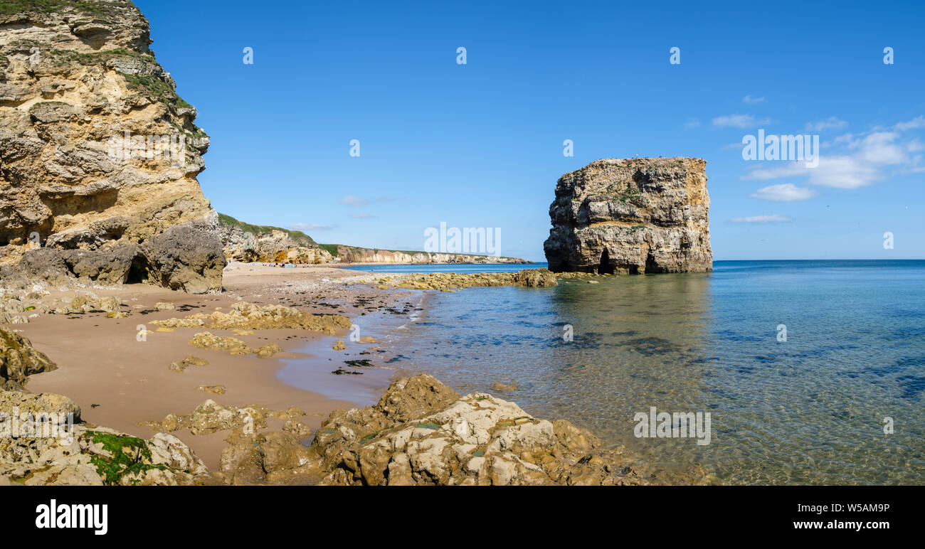 Marsden Rock and the sandy beach at Marsden Bay on the coast near South Shields South Tyneside, Tyne and Wear Stock Photo