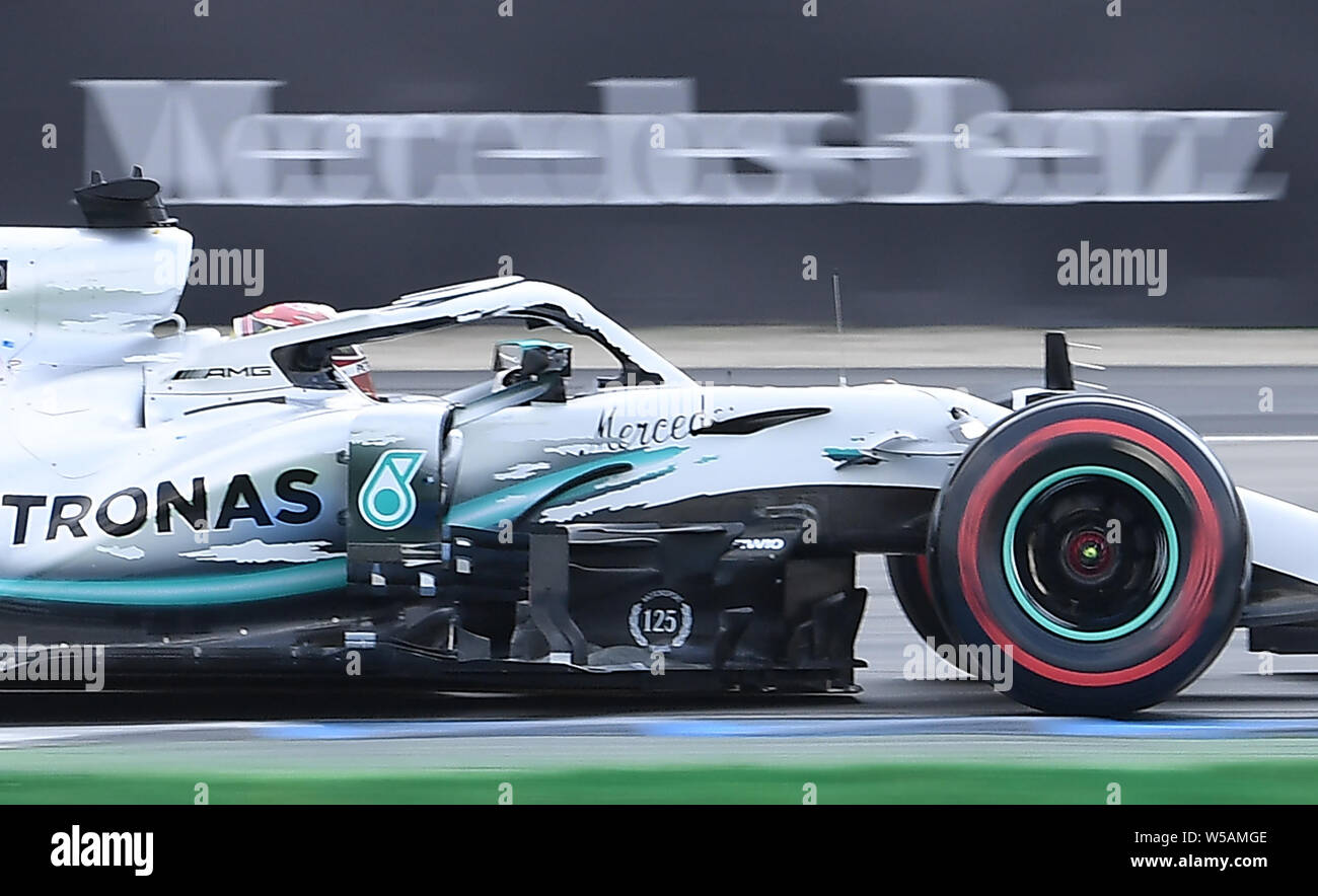 Hockenheim, Germany. 27th July, 2019. Motorsport: Formula 1 World Championship, Grand Prix of Germany. Lewis Hamilton from Great Britain of the Mercedes-AMG Petronas team drives across the track in qualifying. Credit: Sebastian Gollnow/dpa/Alamy Live News Stock Photo