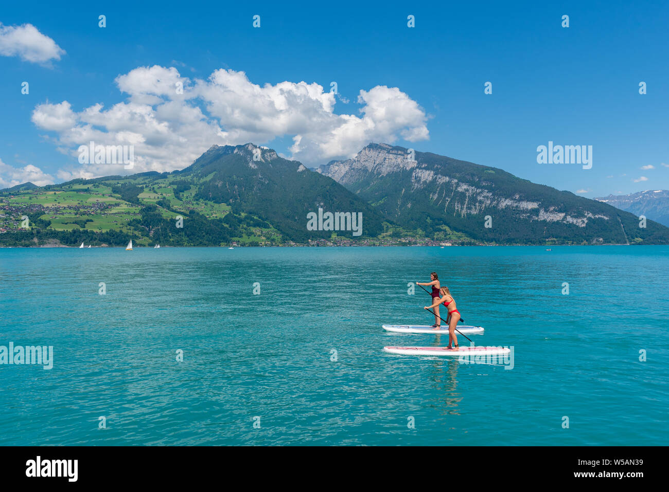 Standup paddling on Lake Thun, Spiez, Bernese Oberland, Switzerland