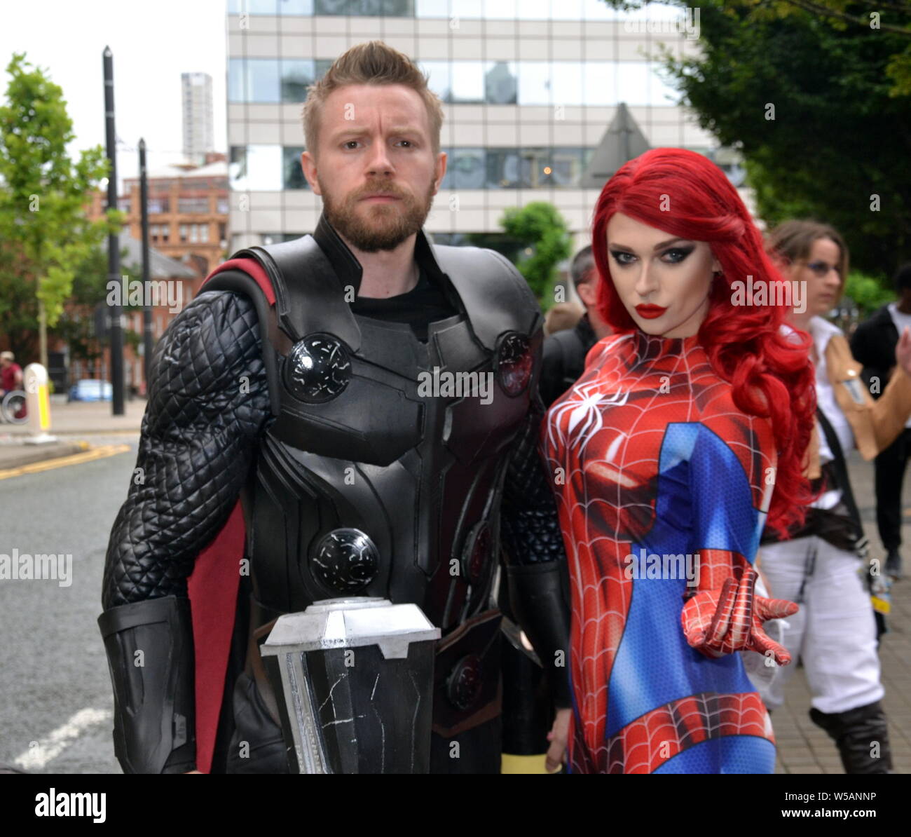 Attendees at the MCM Comic Con pop culture convention in Manchester, uk, July 27, 2019, at the start of a two day event where many participants dress up as their favourite superhero, anime, villain or pokemon character. The event attracts thousands of sci- fi enthusiasts, comic collectors, fantasy and game fans to the Manchester Central Convention Centre in city centre Manchester. Stock Photo