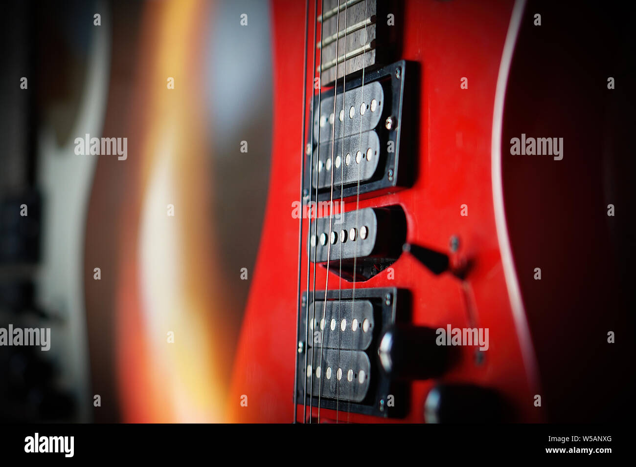 Close-up electric guitar sunbeams musical card. Musical string instrument, a good idea for music. Stock Photo
