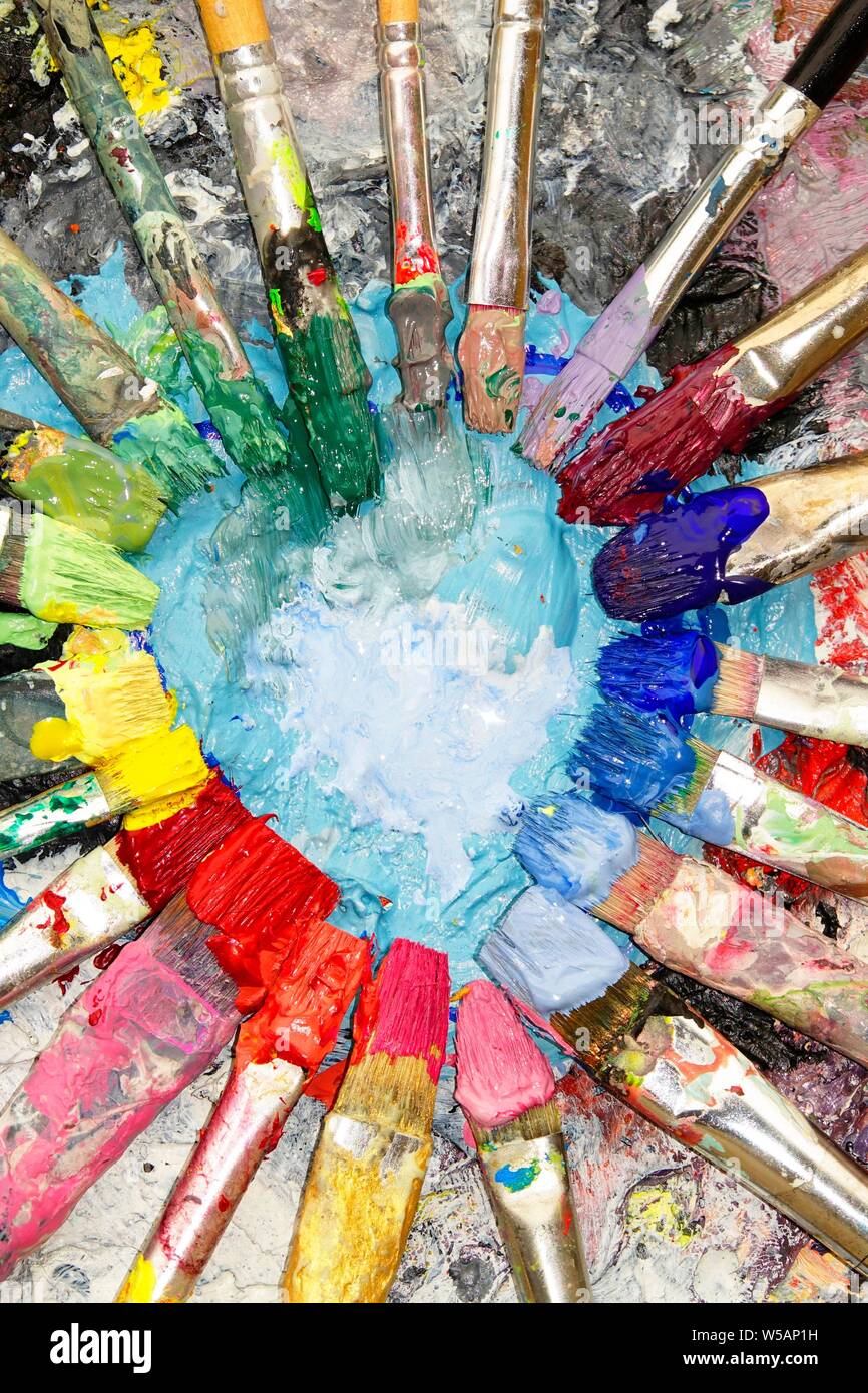 Many colorful brushes, acrylic paint, color circle, artist palette
