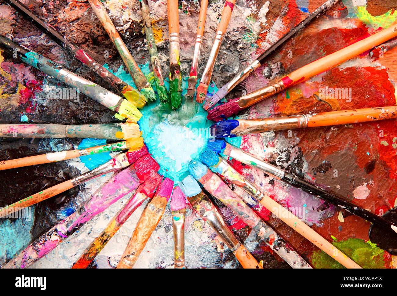 Many colorful brushes, acrylic paint, color circle, artist palette