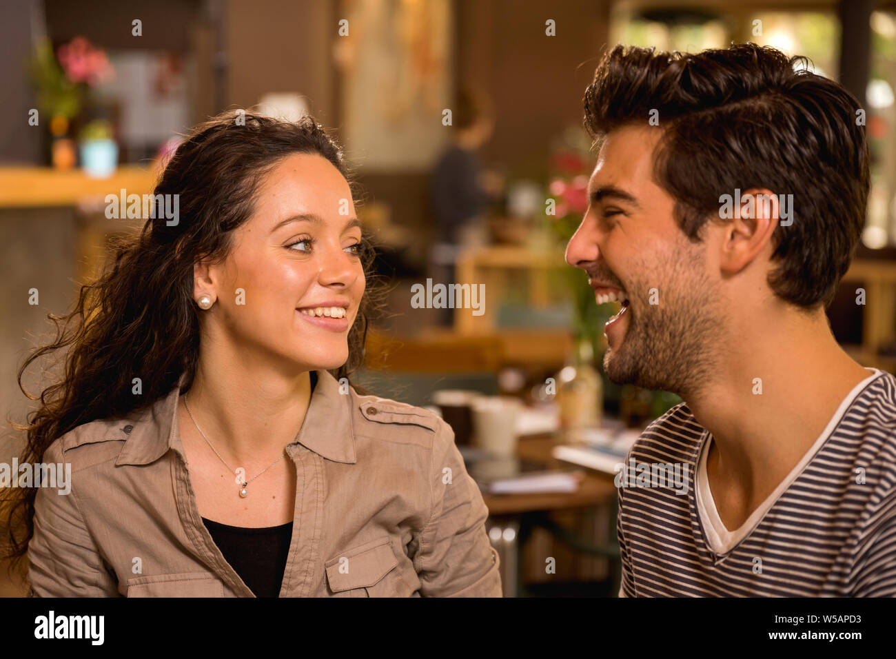 A beautiful and young couple looking each other Stock Photo