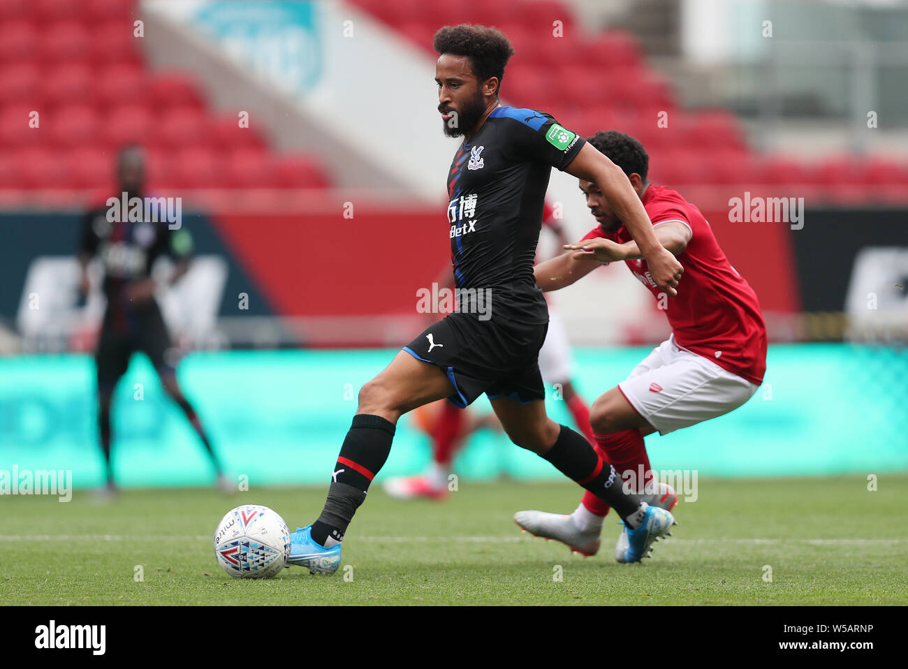 Crystal Palace Andros Townsend is challenged by Bristol City's Jay Dasilva during the pre-season friendly match at Ashton Gate, Bristol. Stock Photo