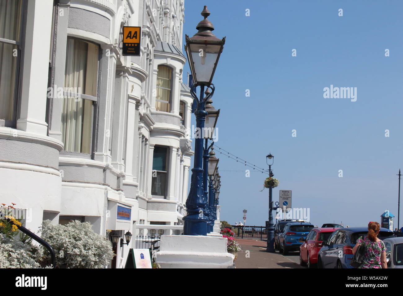 Holiday makers enjoying the good weather on Llandudno beach, Wales