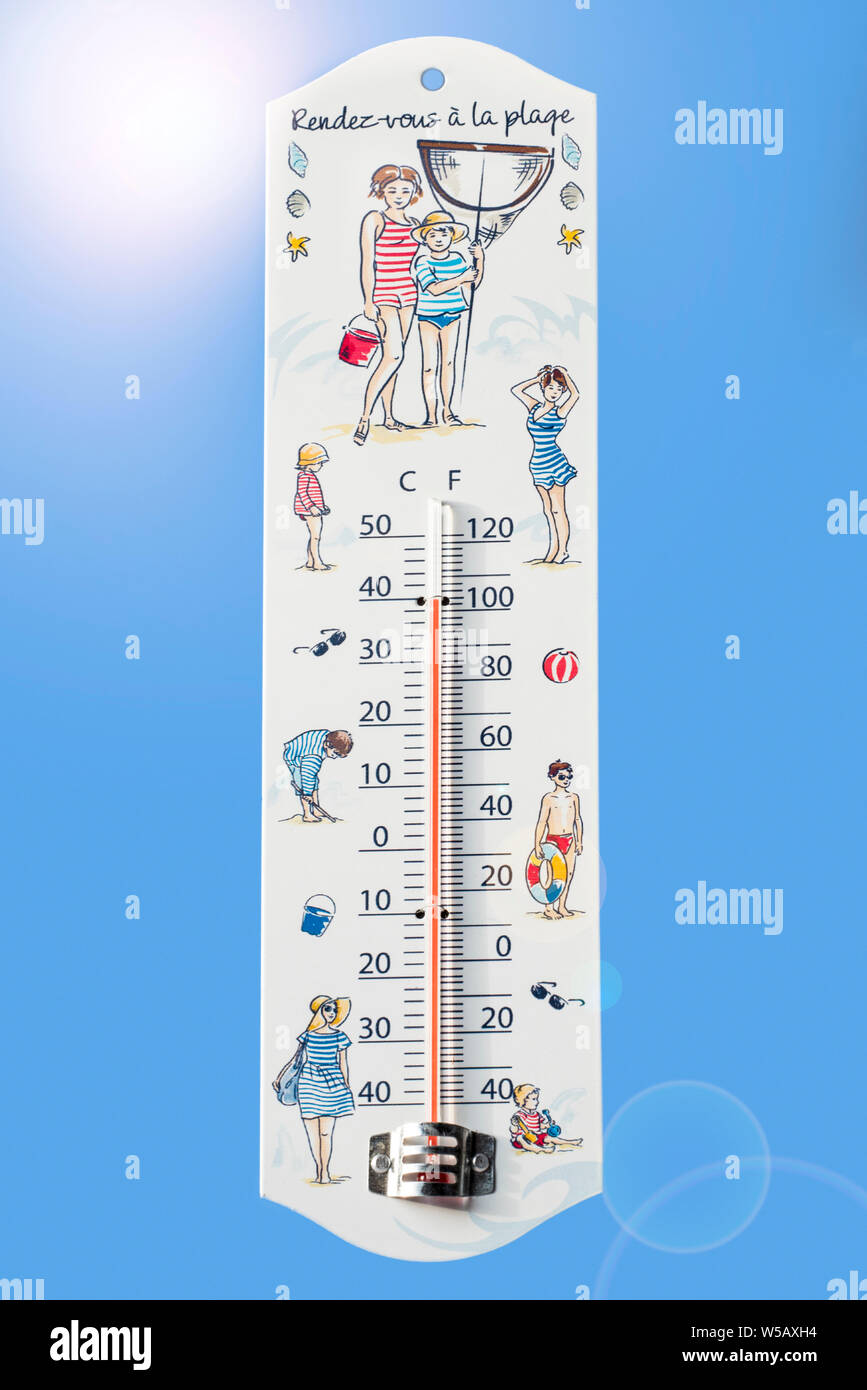 Thermometer measures extremely hot temperature of 40 degrees Celsius / 40 °C / 40°C / 100 °F during heatwave / heat wave in summer Stock Photo