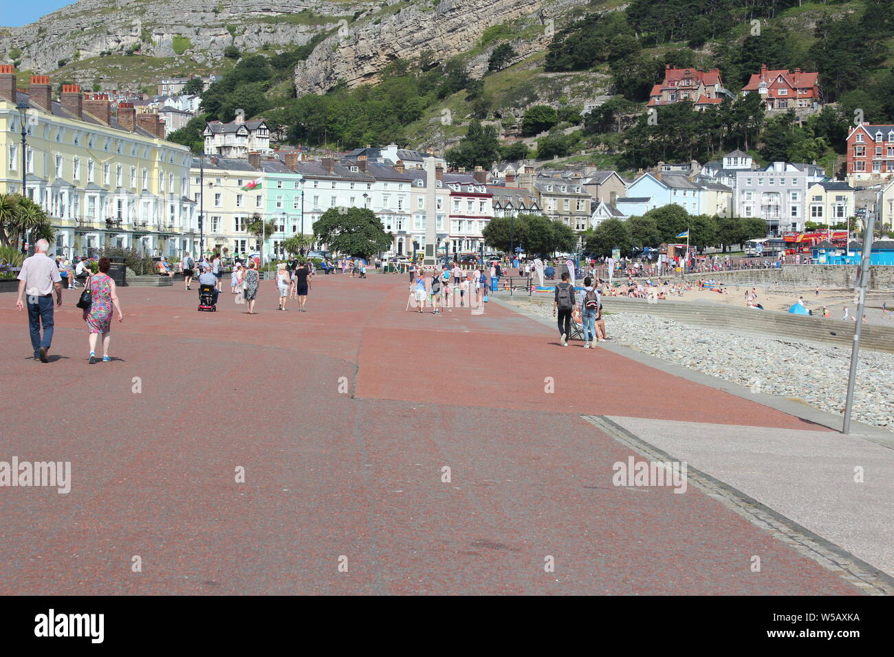 Holiday makers enjoying the good weather on Llandudno beach, Wales
