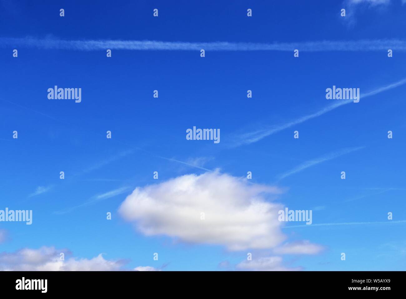 Beautiful white fluffy clouds on a deep blue summer sky Stock Photo - Alamy