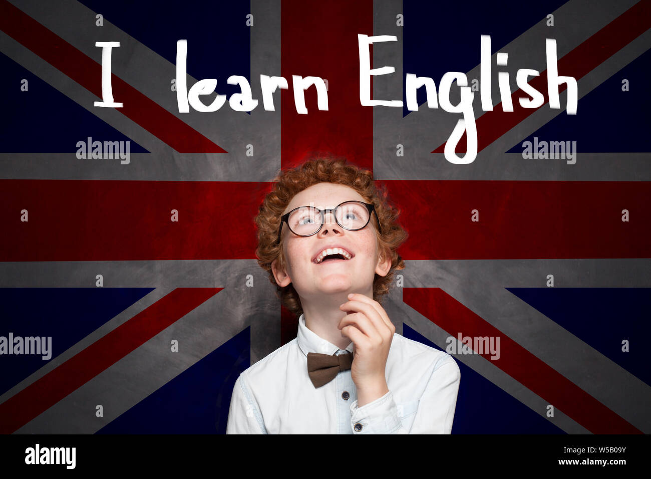 Little school boy with the UK flag background and Learn English ...