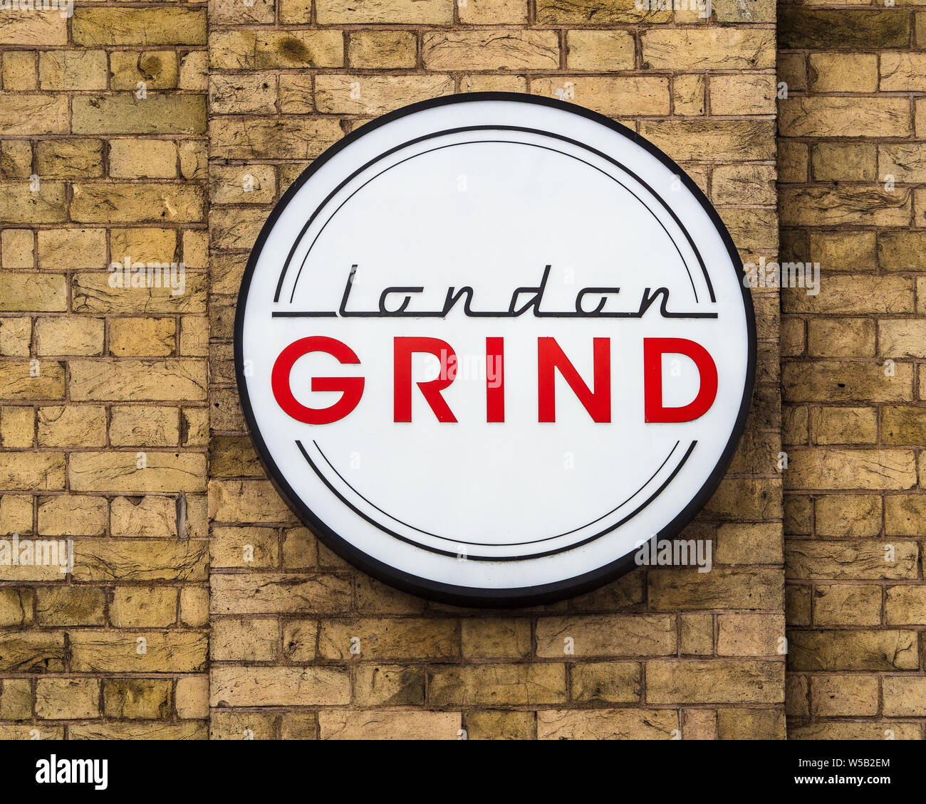 London Grind sign - London Grind is a riverside espresso bar, cocktail bar and restaurant near London Bridge in Central London Stock Photo