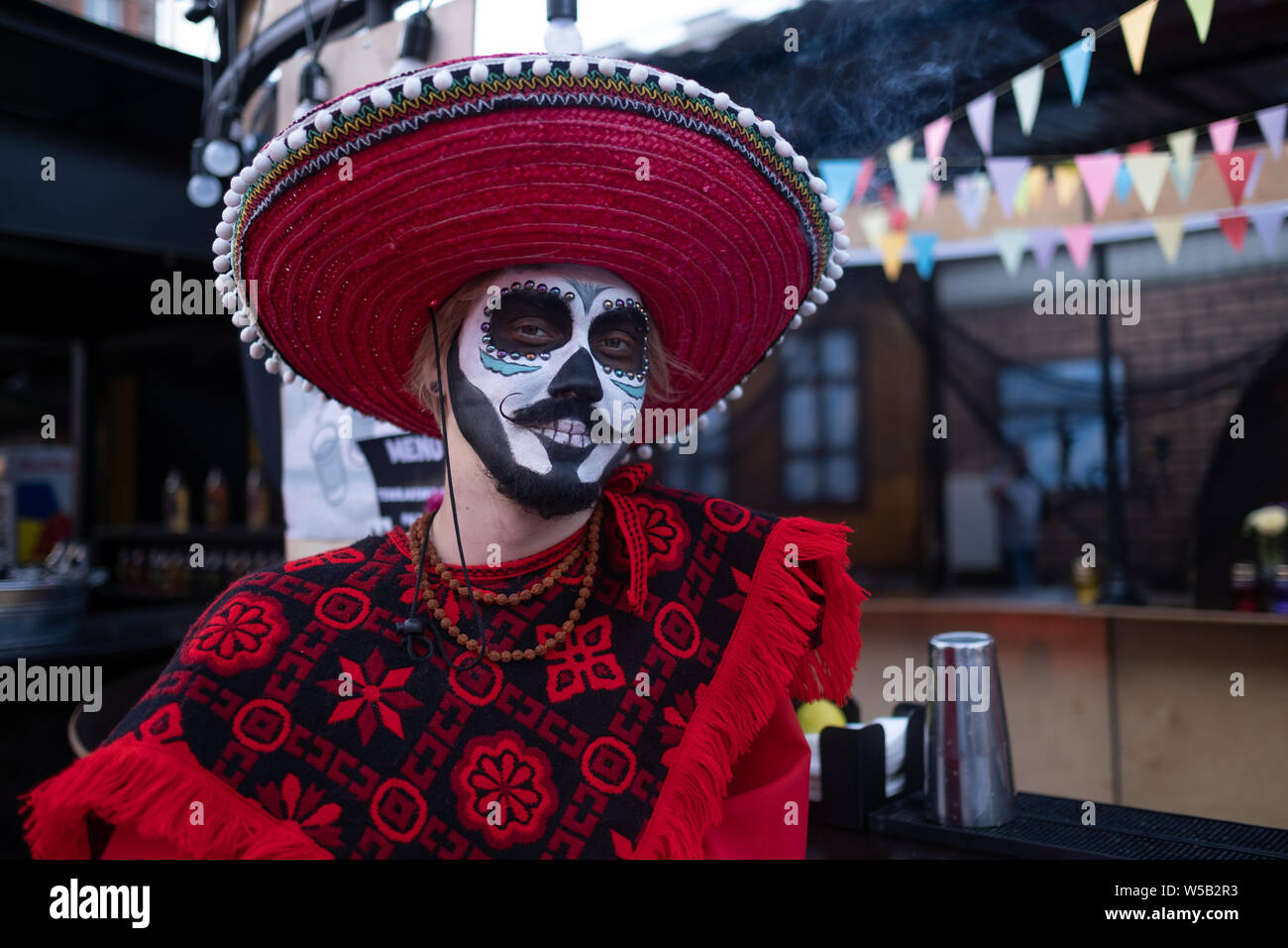 Kyiv, Ukraine, Santa Muerte Carnival, 20.07.2019. Dia de los Muertos, Day of the Dead. halloween. Man with face paint and wearing a mexican mariachi s Stock Photo