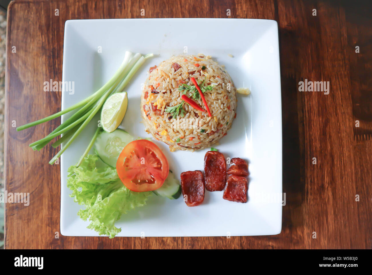 stir-fried rice with deep fried sausage and vegetable Stock Photo