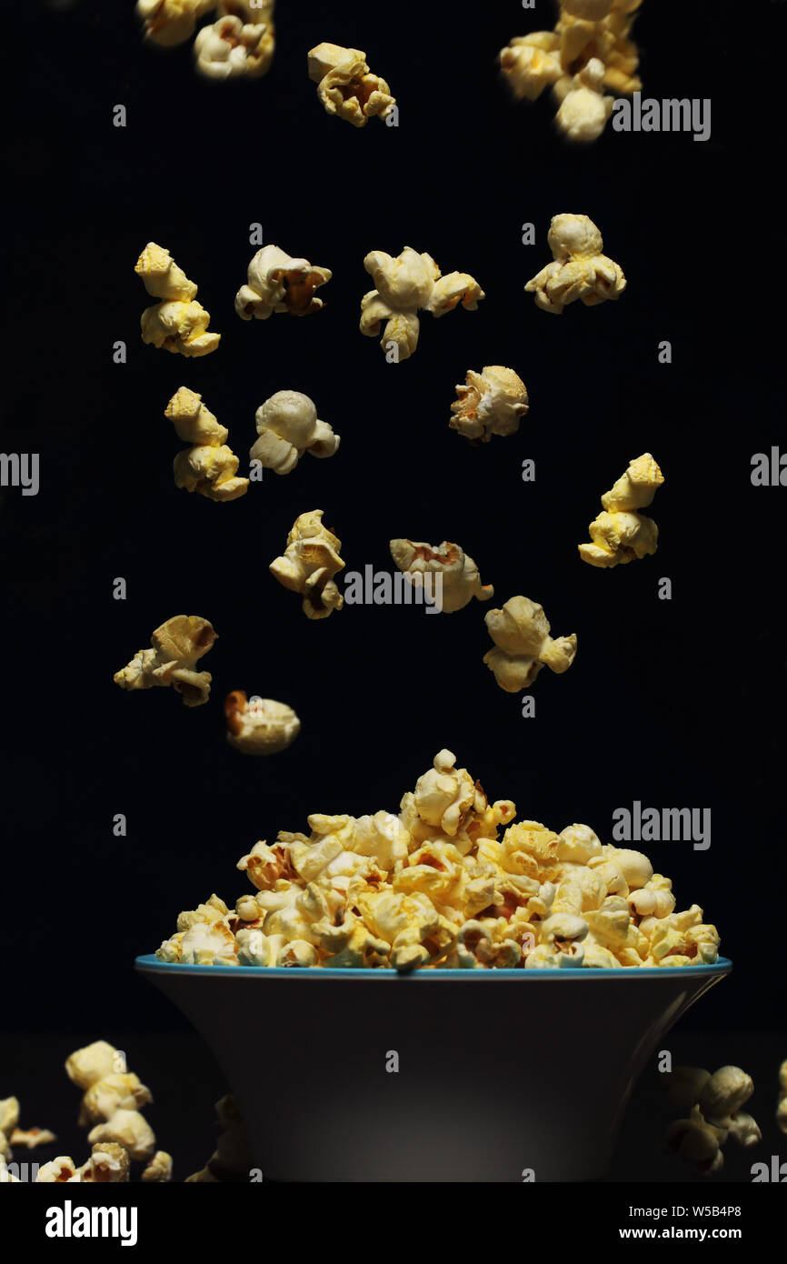 Popping popcorn Stock Photo