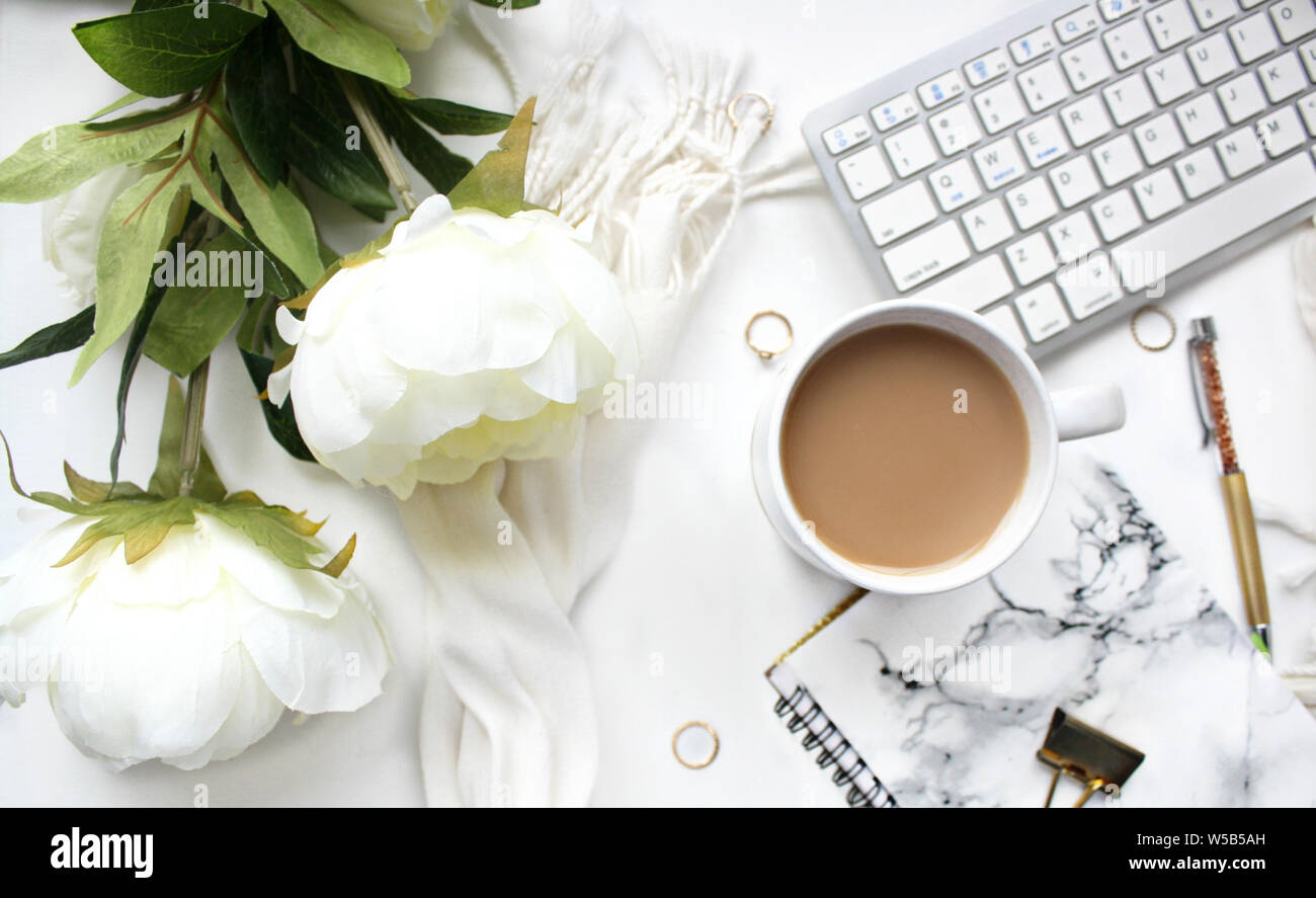 Female workspace on white background Stock Photo