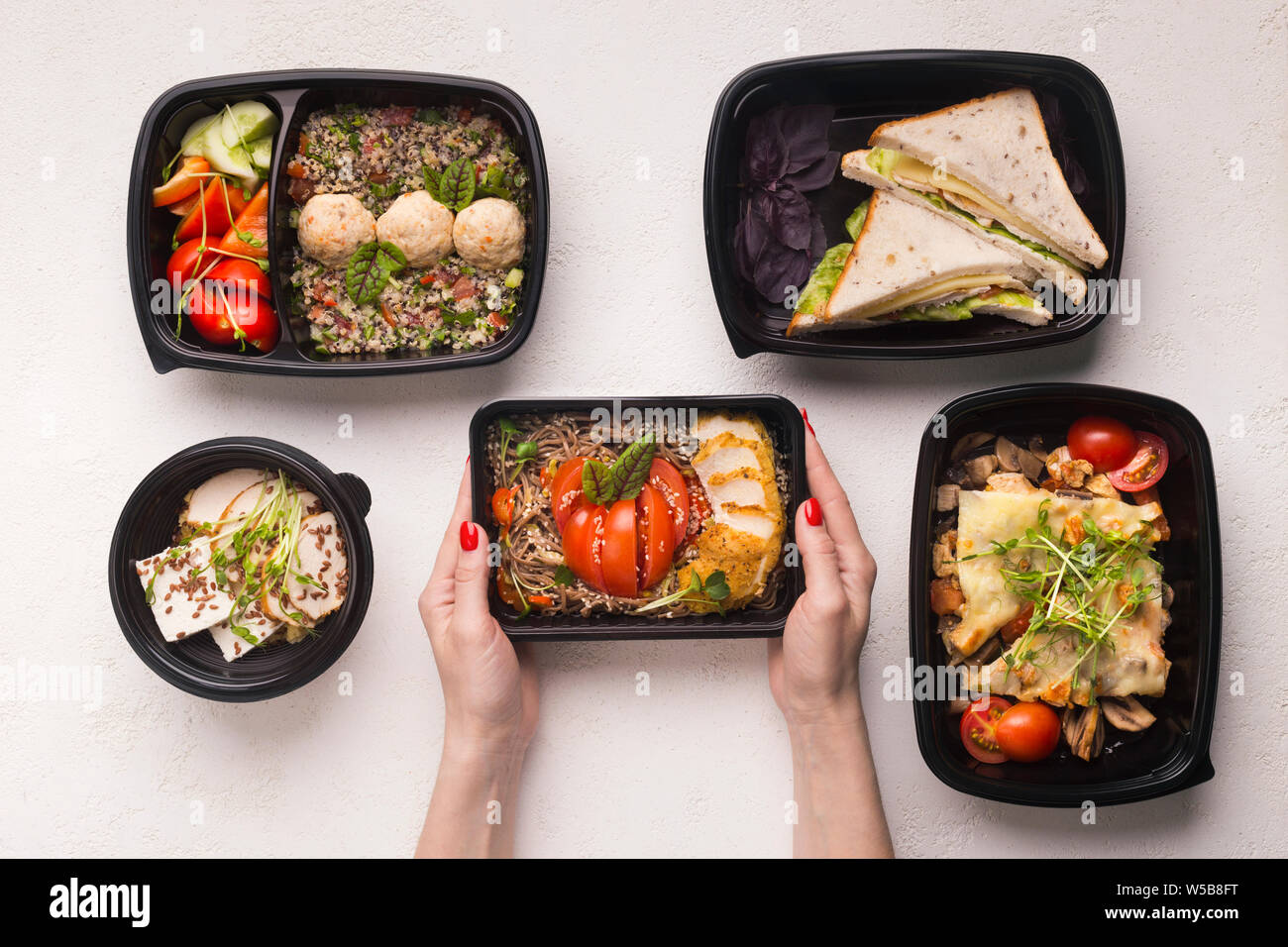 Resraurant food in take away boxes for healthy nutrition Stock Photo