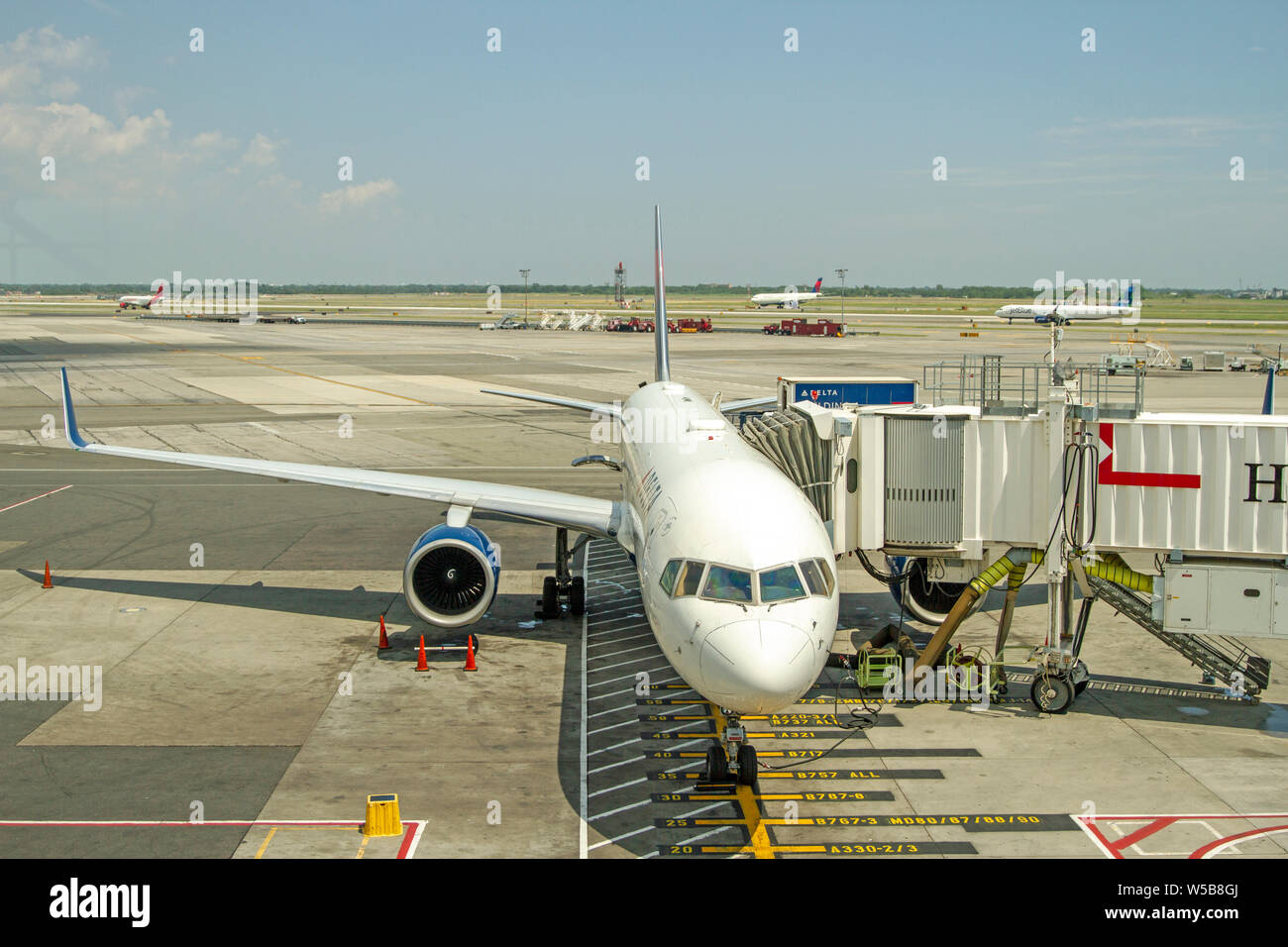 Airplanes loading passengers Stock Photo - Alamy